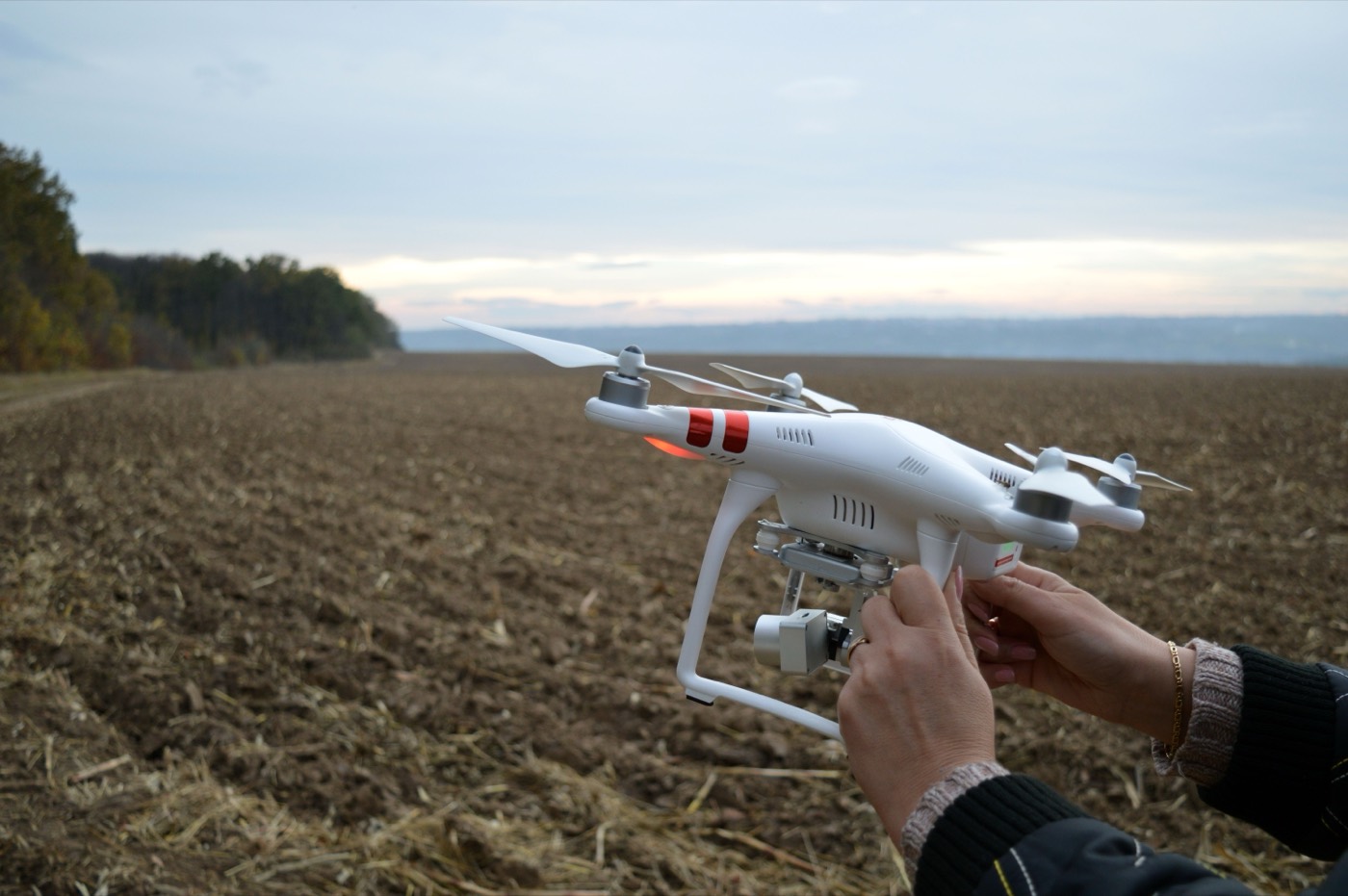 Drone operator preparing a UAV before a commercial flight